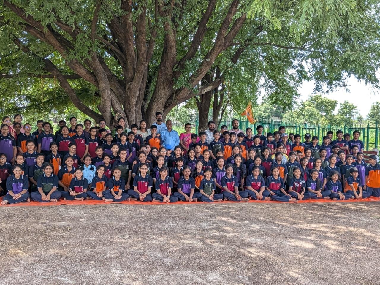 A school group under the campus tree at the Centre for Agri Tourism